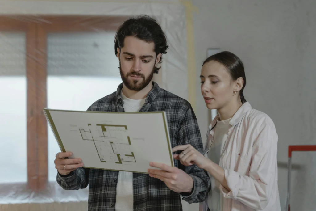 Couple looking at house blueprints